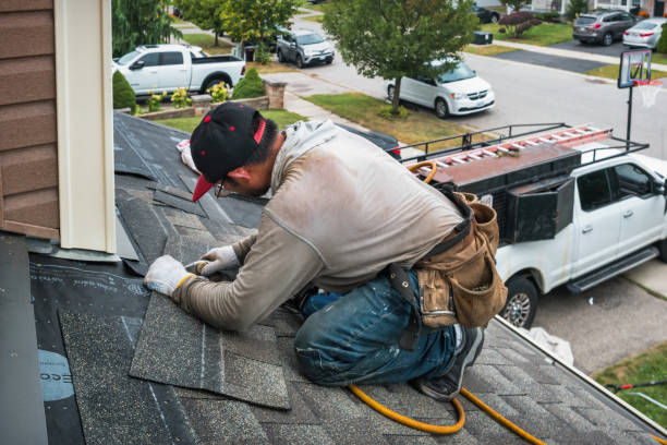 Professional Roofing technician working in Inwood, NY